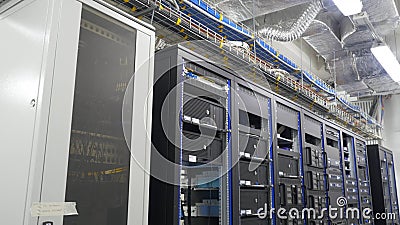 Many powerful servers running in the data center server room. Many servers in a data center. Many racks with servers Stock Photo