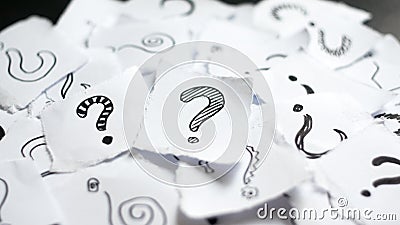 Many question marks on papers. Doodle drawn question marks on scraps of paper. Choice, decision making, assortment concept Stock Photo