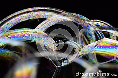 Many rainbow bubbles on a black background. Abstract detail Stock Photo