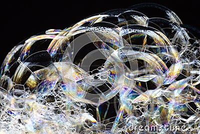 Many rainbow bubbles on a black background. Abstract detail Stock Photo