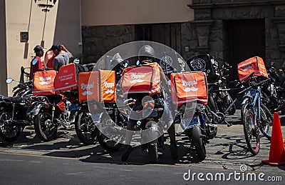 Many Rappi motorbikes parked outside a restaurant Editorial Stock Photo