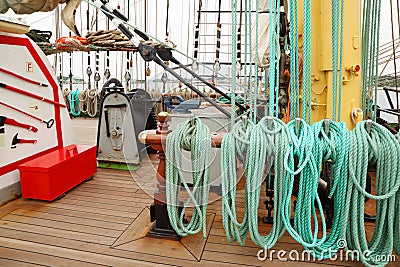 Many ropes, windlass and rigging on an ship Stock Photo