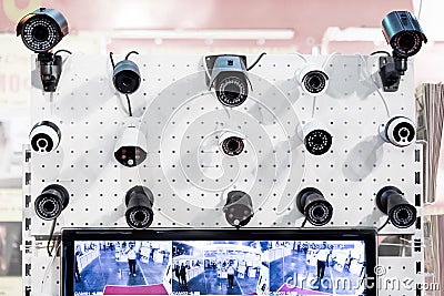 Many rows of white an black professional surveillance camera. Wall mounted CCTV. Security system concept. Security exhibition Editorial Stock Photo