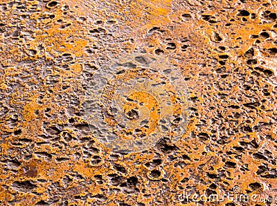Rugged holes on the rusty color concrete floor Stock Photo