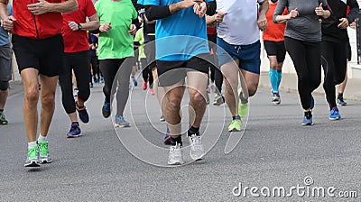 many runners at footrace Stock Photo