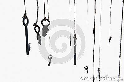Many rustic keys hanging on string. Selective focus. Isolated Stock Photo