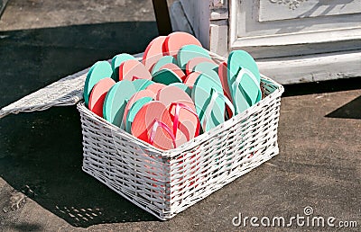 Many sandal have many color. Schists pink and green in a basket Stock Photo