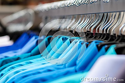 Many shirts hanging Stock Photo