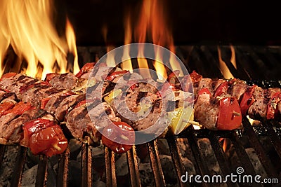 Many Shish Kebab On The BBQ Flaming Charcoal Grill Stock Photo