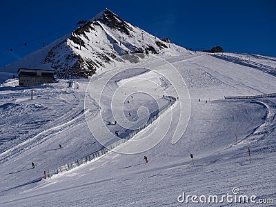 HIgh peak and skiers Stock Photo