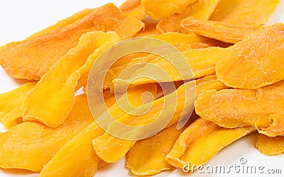 Many slices of dried mango close-up. Stock Photo