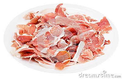 Many slices of dry-cured ham on plate isolated Stock Photo