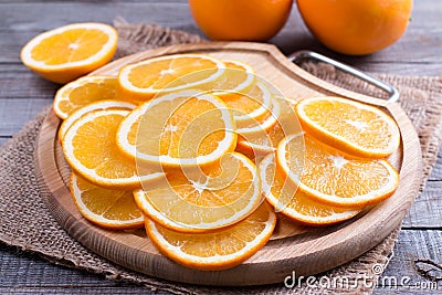 Many slices of fresh orange on a cutting board Stock Photo