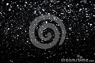 Many snowflakes in blur on black background. Snowfall layer for winter project Stock Photo