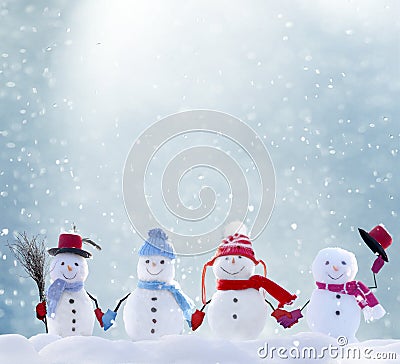 Many snowmen standing in winter Christmas landscape Stock Photo