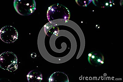 Many soap bubbles on a dark background, soft focus Stock Photo