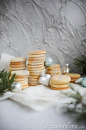 Many stacks of shortbread cookies on a concrete background Stock Photo