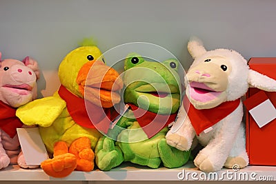 Many stuffed animal toys on shop shelve Stock Photo