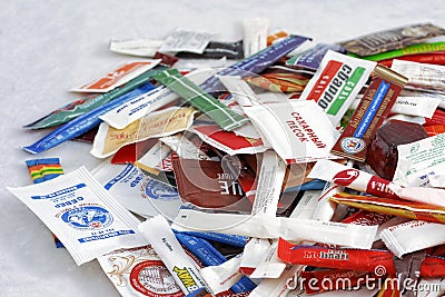 Many sugar sachets of cafes and restaurants from different countries. Illustrative editorial photo collection packets. Editorial Stock Photo