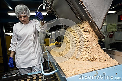 Many sweet cake food factory massive production Editorial Stock Photo