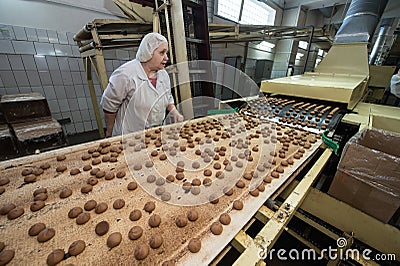 Many sweet cake food factory massive production Editorial Stock Photo