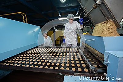 Many sweet cake food factory massive production Editorial Stock Photo