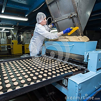 Many sweet cake food factory massive production Editorial Stock Photo