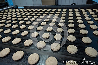 Many sweet cake food factory massive production Editorial Stock Photo