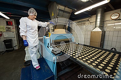 Many sweet cake food factory massive production Editorial Stock Photo