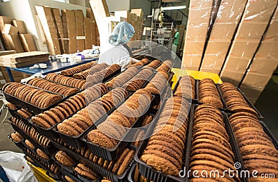 Many sweet cake food factory massive production Editorial Stock Photo