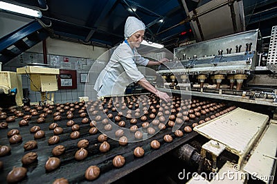 Many sweet cake food factory massive production Editorial Stock Photo