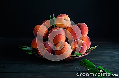 Many sweet peaches in a plate Stock Photo