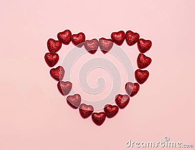 Many sweet red candies heart shaped isolated Stock Photo