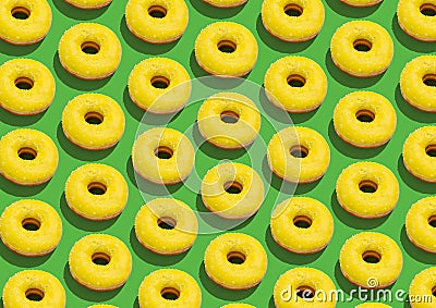Many Sweet Tasty Donuts With Yellow Glaze And Sprinkles Over Green Background Stock Photo