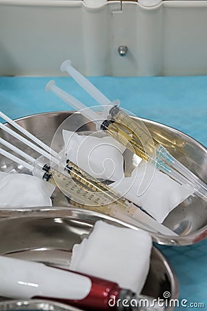 Many syringes with plasma in silver tray prepared for PRP procedure - Platelet rich plasma rejuvenating treatment Stock Photo