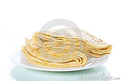 Many thin fried pancakes in a plate Stock Photo