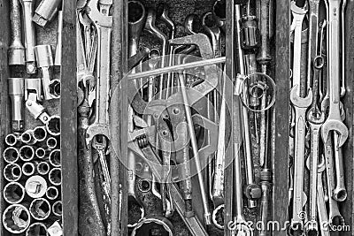 Many tools in rustic compartments toolbox. Technical machanic to Stock Photo