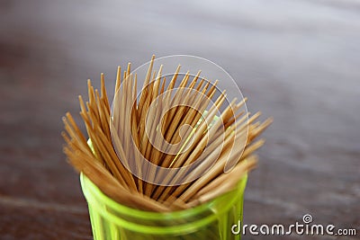 Many toothpicks are in a green plastic box. Stock Photo