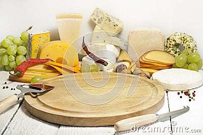 Many types of cheese on cutting board abstract Stock Photo