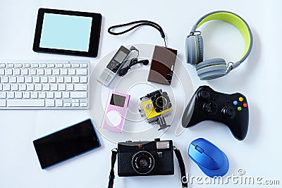 Many used modern Electronic gadgets for daily use on White floor, Reuse and Recycle concept Stock Photo