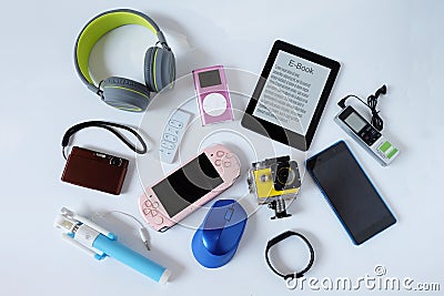 Many used modern Electronic gadgets for daily use on White floor, Reuse and Recycle concept Stock Photo