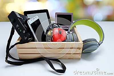 Many used modern Electronic gadgets for daily use in wooden cases on white background Stock Photo