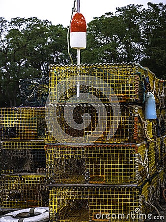 Rustic lobster traps piled at the marina Stock Photo