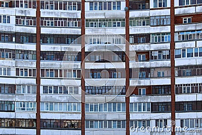 Many windows in a multi-storey building with balconies Stock Photo