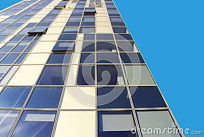 Many windows of skyscraper building on blue sky background Editorial Stock Photo