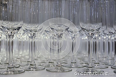 Many wine glasses on table. rows of empty wine glasses Stock Photo