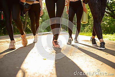 Many women with mats, group yoga training Stock Photo