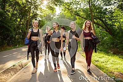 Many women with mats, group yoga training Stock Photo