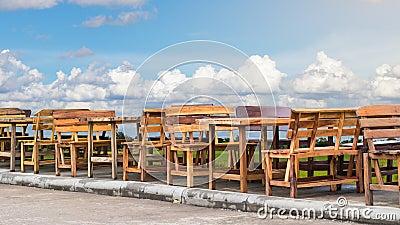 Many wood benches with sky clouds. Stock Photo