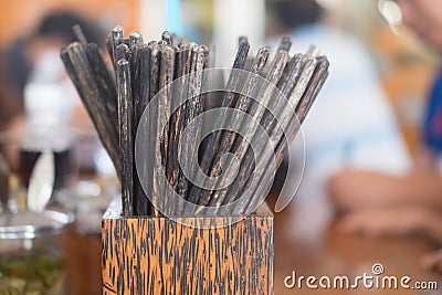 Many wood chopsticks in a box Stock Photo